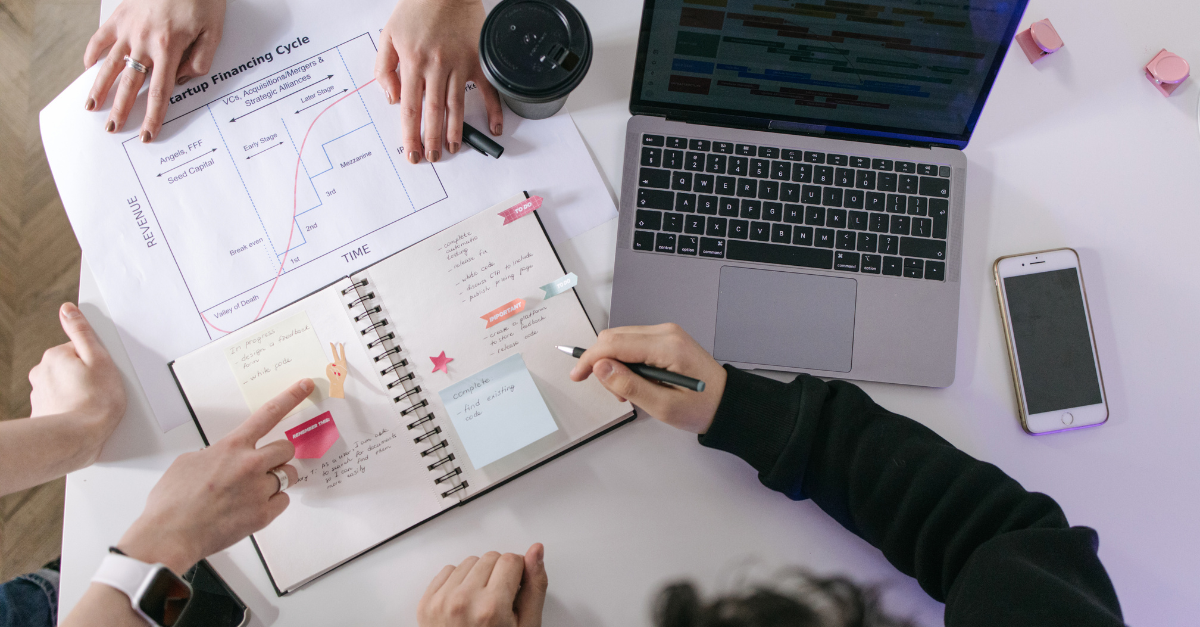 B2B marketing team analysing strategy while AI automates execution workflows