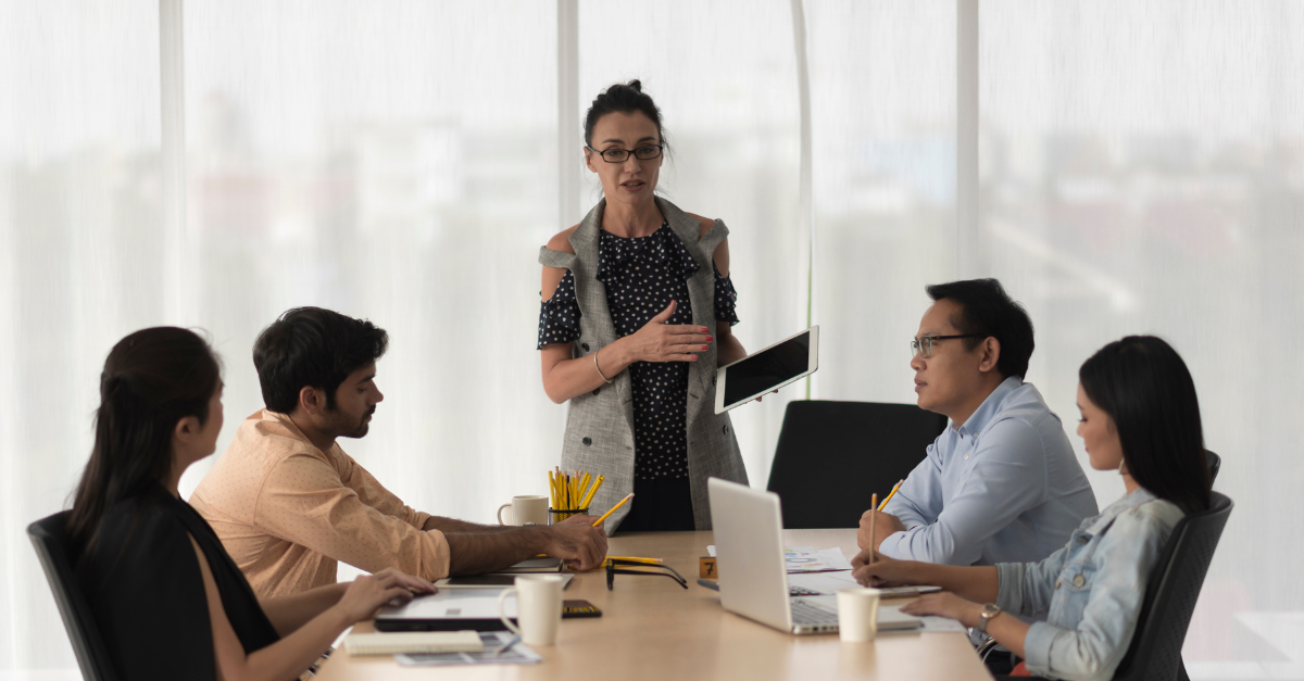 Indian executives discussing a B2B buying committee decision in a boardroom