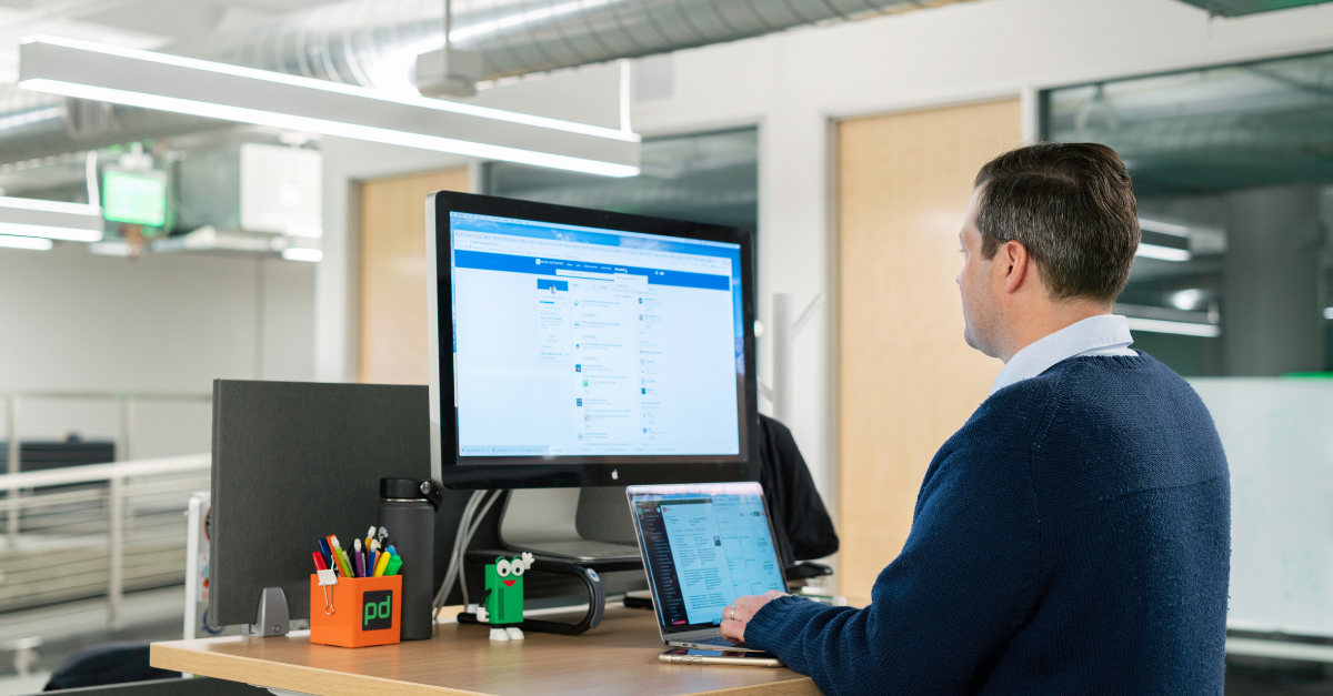 Indian B2B founder building a LinkedIn personal branding presence on a laptop at office