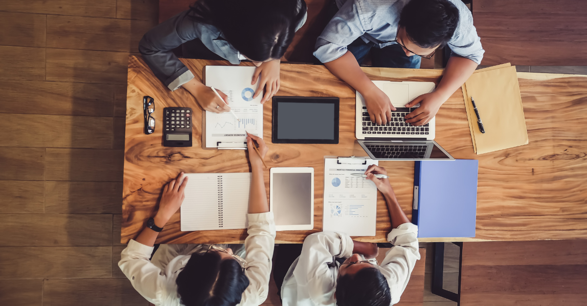 B2B sales and marketing teams collaborating to accelerate pipeline velocity across enterprise buying committees